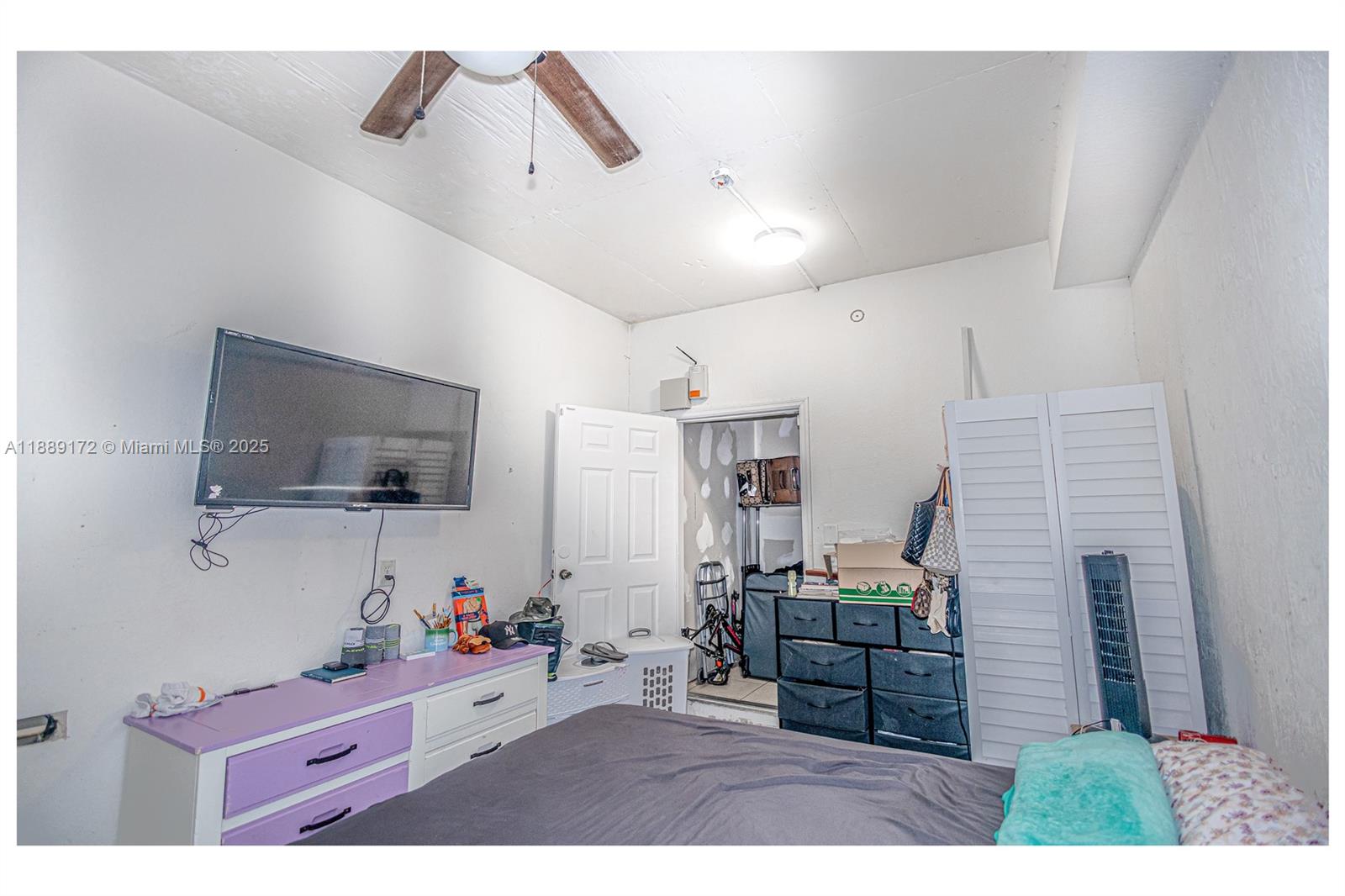 18272 Southwest 108th Path Miami, FL 33157 - Photo 19 of 27 a living room with furniture and a flat screen tv