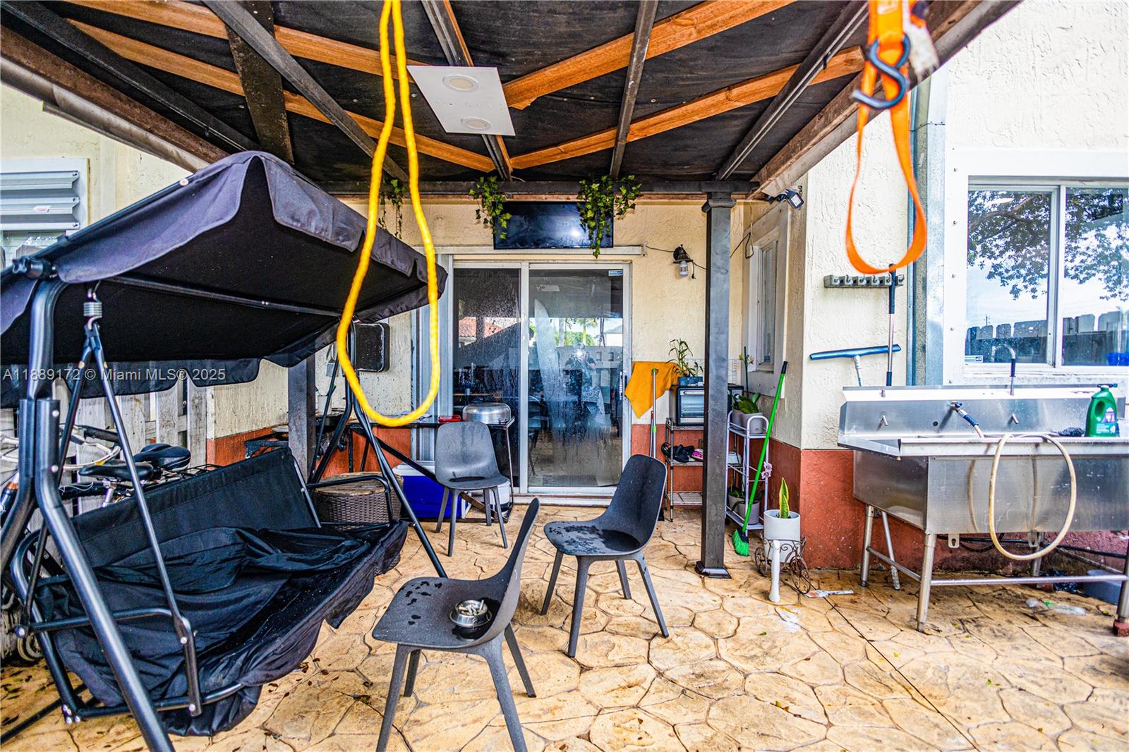 18272 Southwest 108th Path Miami, FL 33157 - Photo 25 of 27 a view of an outdoor sitting area with porch