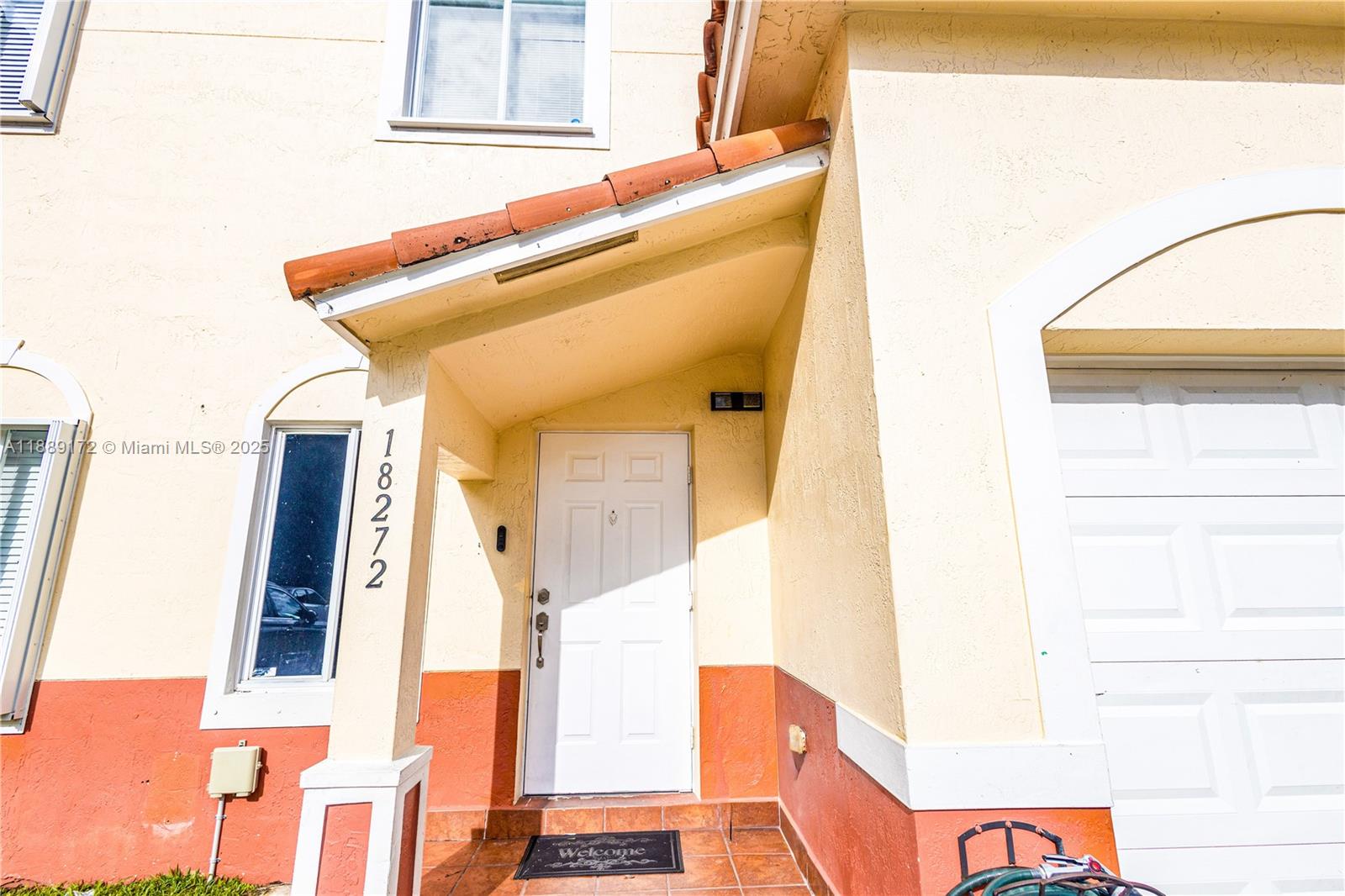 18272 Southwest 108th Path Miami, FL 33157 - Photo 3 of 27 a view of an entryway with furniture