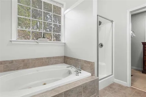 a dining room with furniture a chandelier and wooden floor