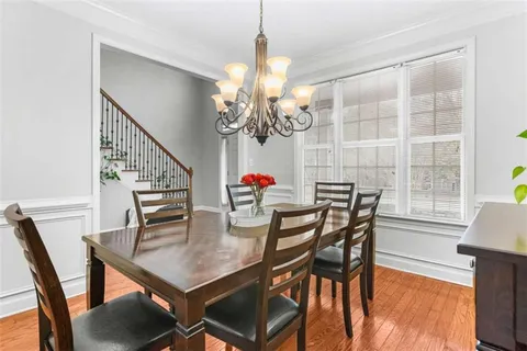 a spacious bedroom with a bed a couch and a window