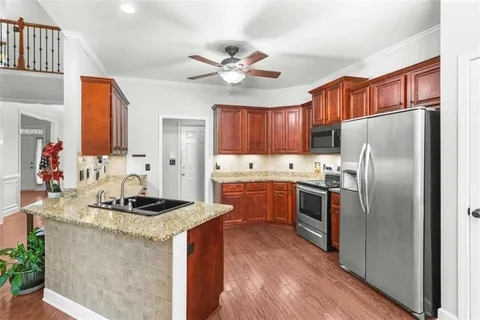 a living room with furniture and white walls