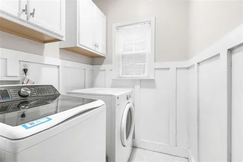 a view of a yard with a large tree