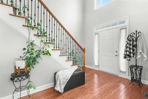 a view of a dining room with furniture and chandelier