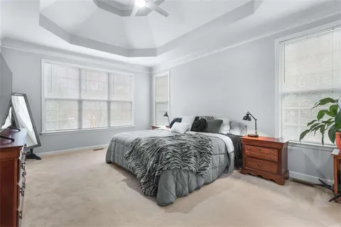 a view of a dining room with furniture and a chandelier