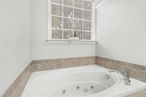 a kitchen with stainless steel appliances granite countertop a stove refrigerator sink and microwave