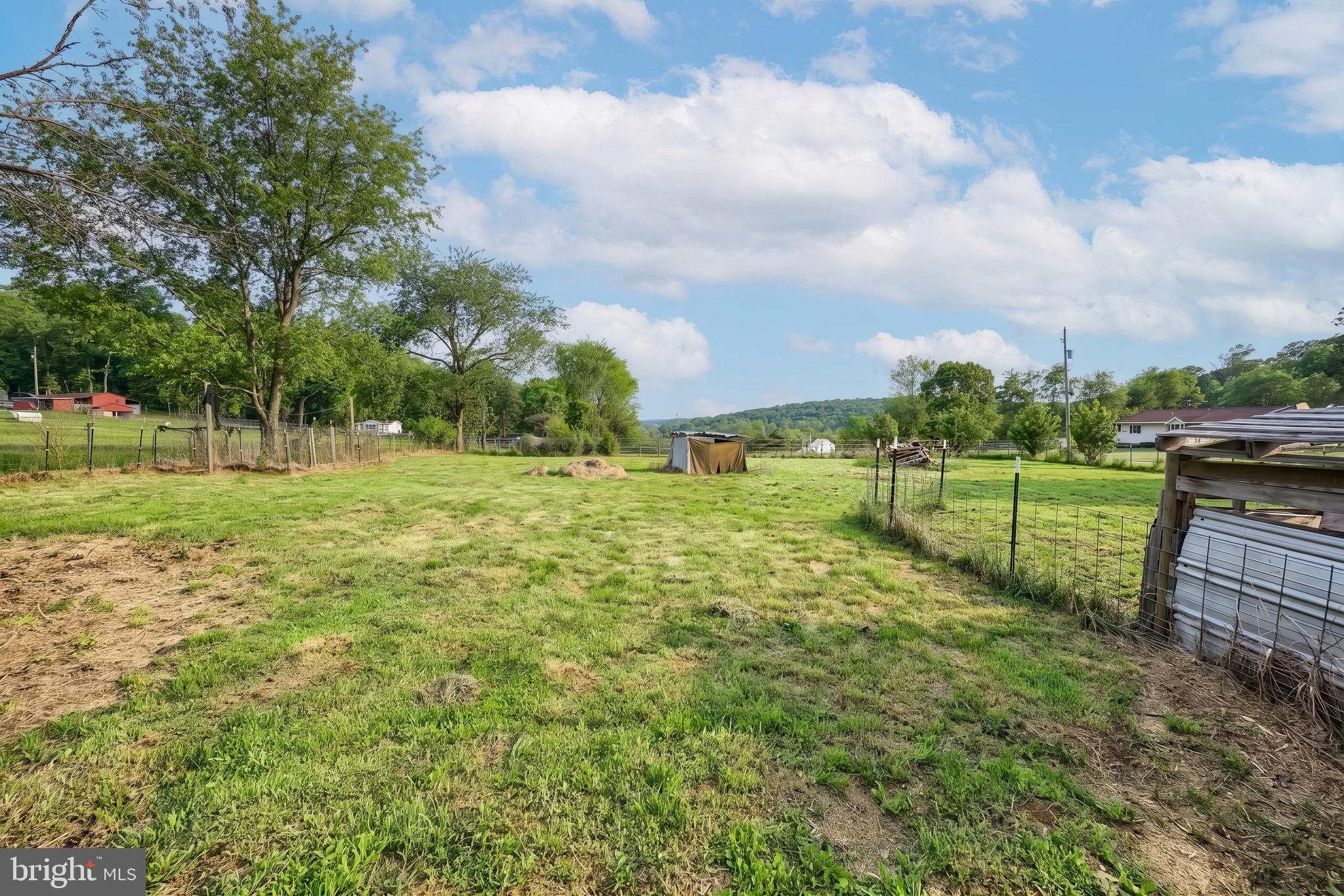 1111 Richmond Road Red Lion, PA 17356 - Photo 9 of 57 a view of a green field with wooden fence