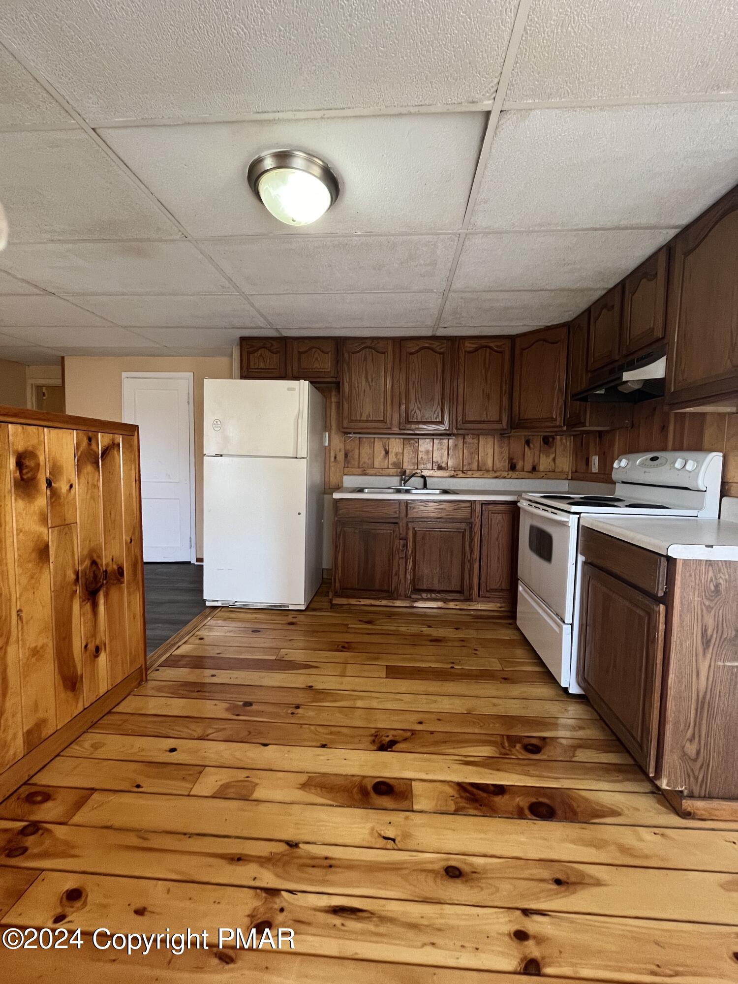 501 North Railroad Street Tamaqua, PA 18252 - Photo 3 of 7 a kitchen with stainless steel appliances granite countertop a stove a sink dishwasher and a refrigerator