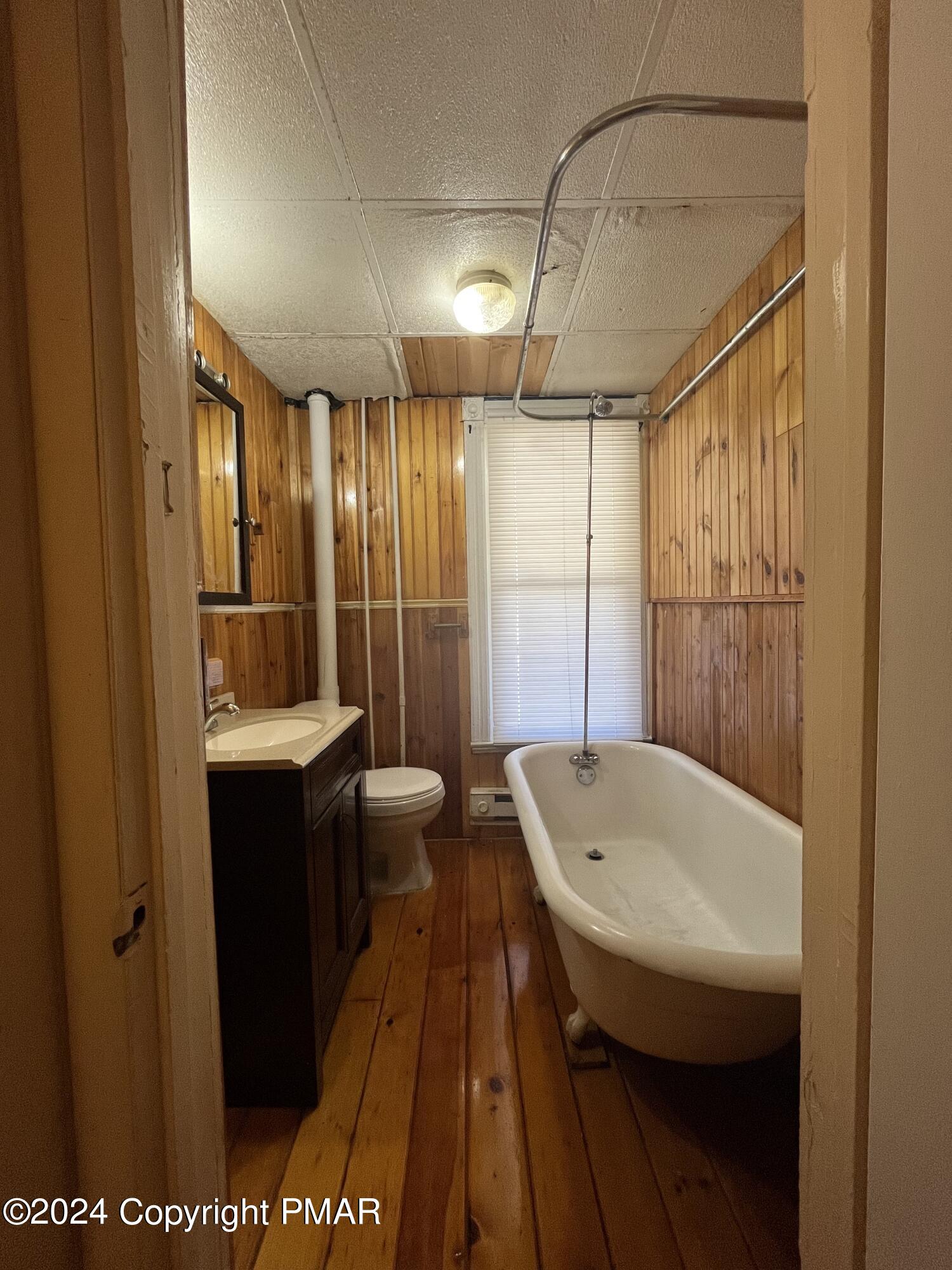 501 North Railroad Street Tamaqua, PA 18252 - Photo 7 of 7 a bathroom with a sink a toilet a mirror and shower