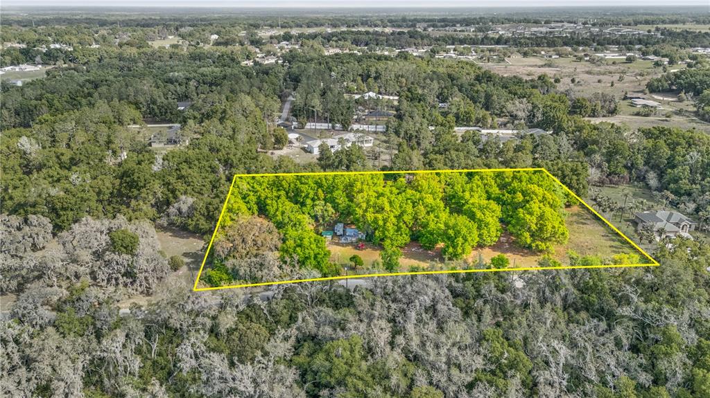 11340 Bessie Dix Road Seffner, FL 33584 - Photo 3 of 14 an aerial view of a residential houses with swimming pool and ocean view