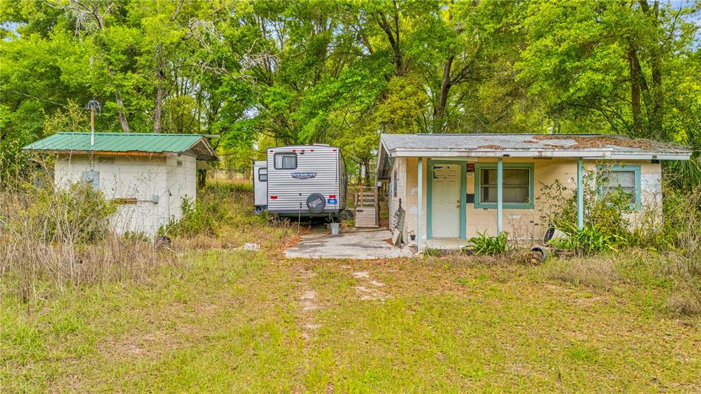 11340 Bessie Dix Road Seffner, FL 33584 - Photo 7 of 14 a house view with a garden space
