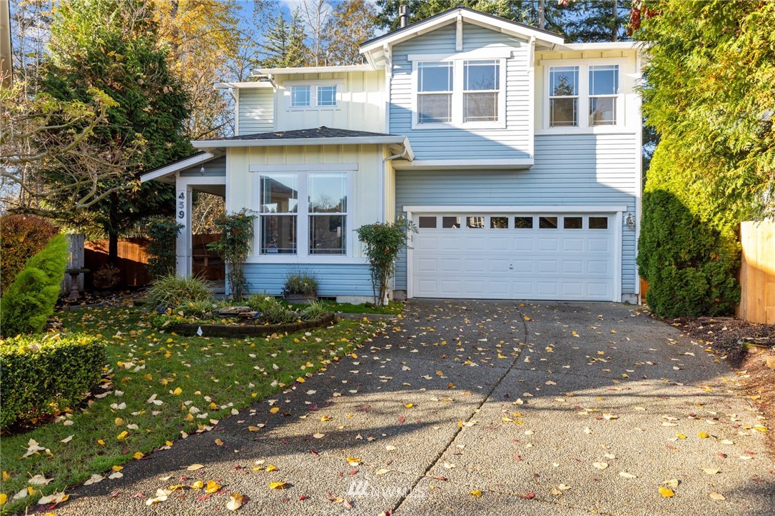 459 Field Place Northeast Renton, WA 98059 - Photo 1 of 40 a front view of a house with a yard and garage