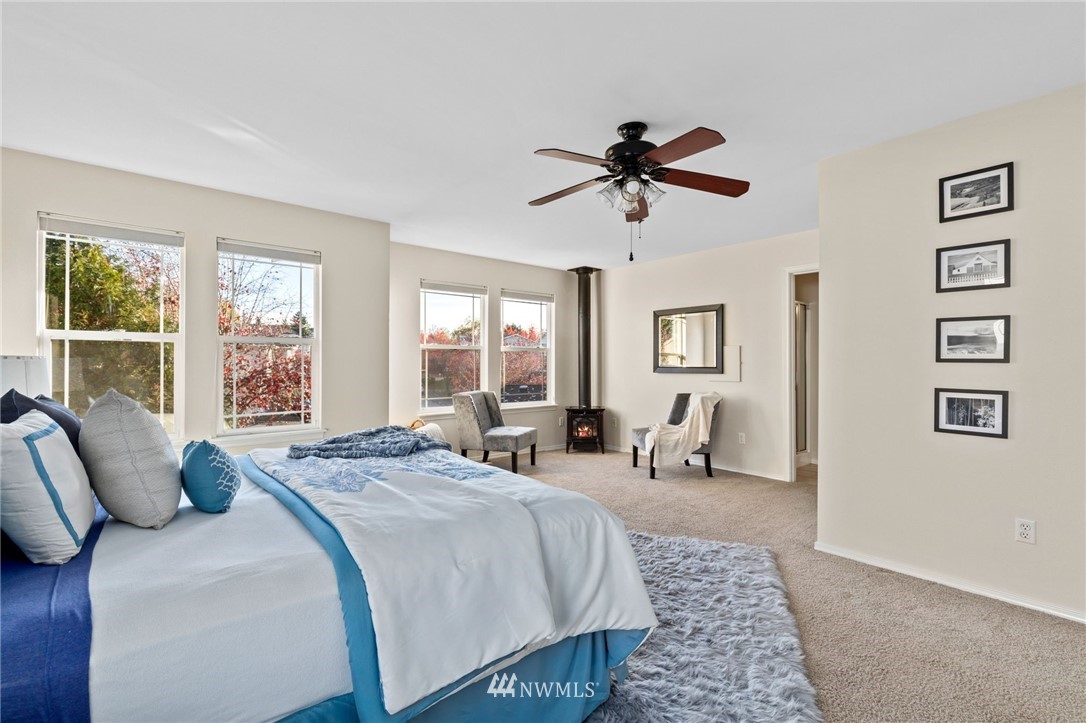 459 Field Place Northeast Renton, WA 98059 - Photo 14 of 40 a bedroom with a bed a couch and dresser
