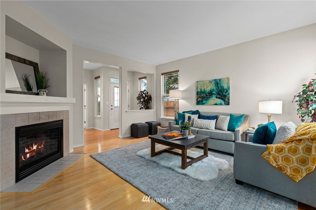 459 Field Place Northeast Renton, WA 98059 - Photo 3 of 40 a living room with furniture and a fireplace