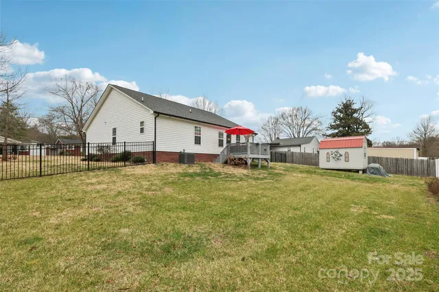 a front view of house with yard and trees