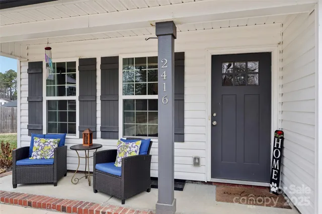 a living room with furniture and windows