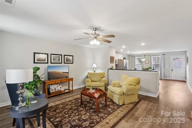 a living room with furniture and a table