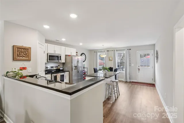 a view of a living room and dining room