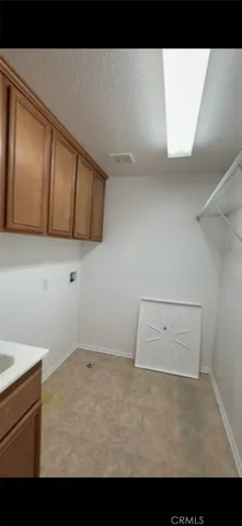 an empty room with a empty space and windows