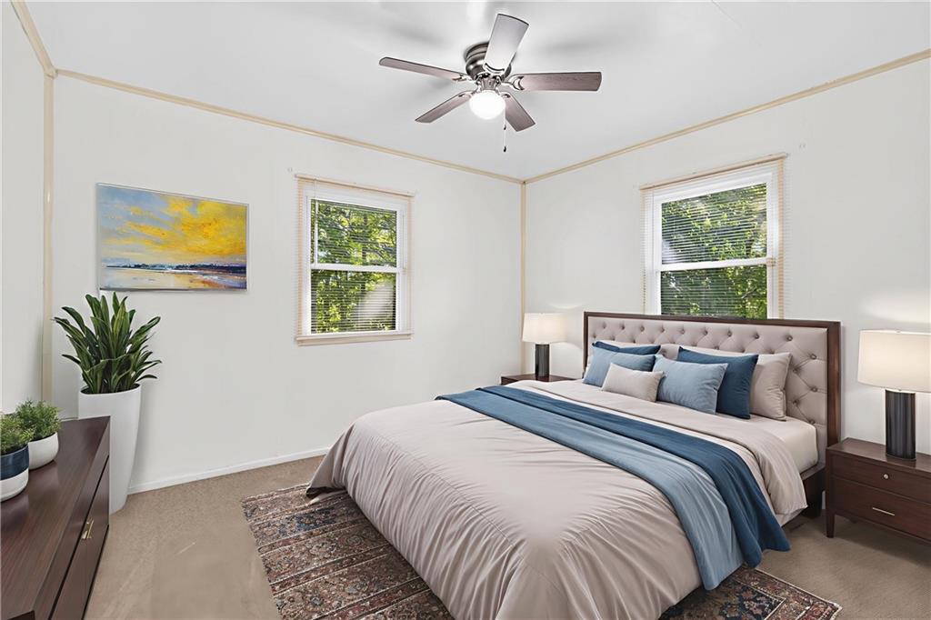 1660 The Circle Washington, PA 15301 - Photo 18 of 50 a bedroom with a bed and a painting on the wall