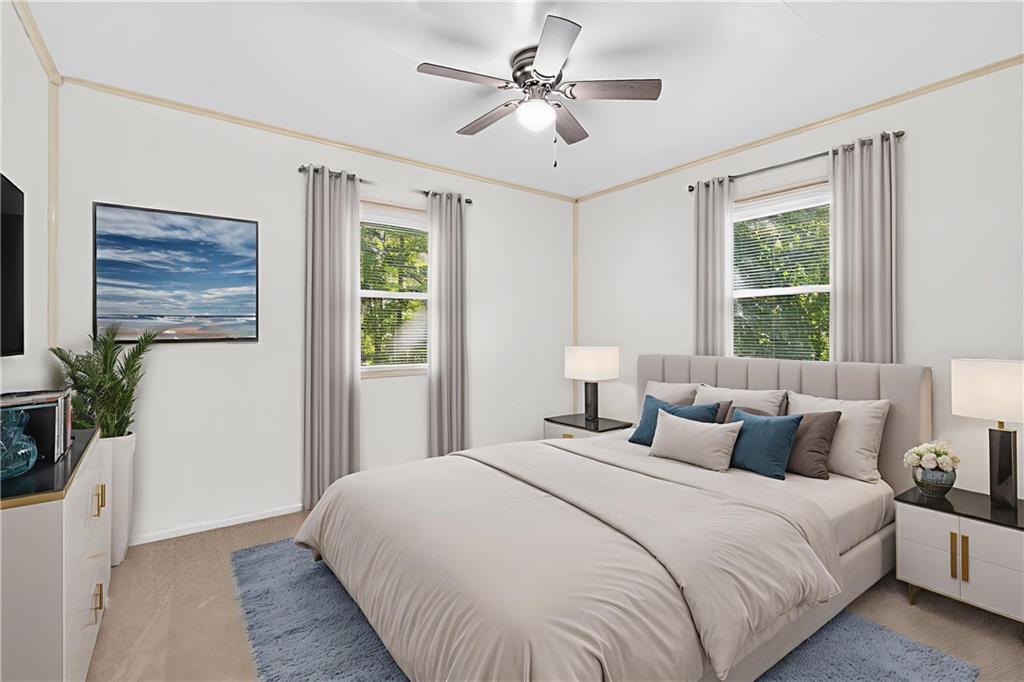 1660 The Circle Washington, PA 15301 - Photo 19 of 50 a bedroom with a large bed a chandelier and a large window