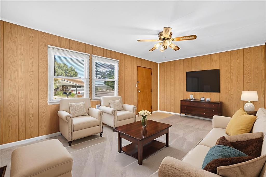 1660 The Circle Washington, PA 15301 - Photo 4 of 50 a living room with furniture a flat screen tv and a window