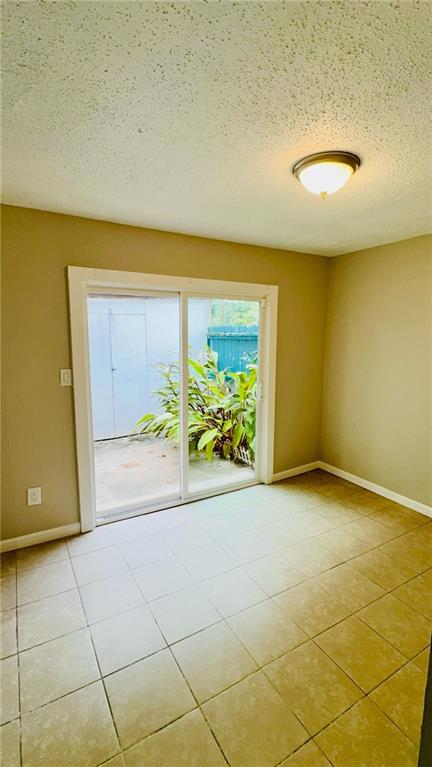 2074 Oak Park Lane Decatur, GA 30032 - Photo 7 of 17 a view of an empty room with a window