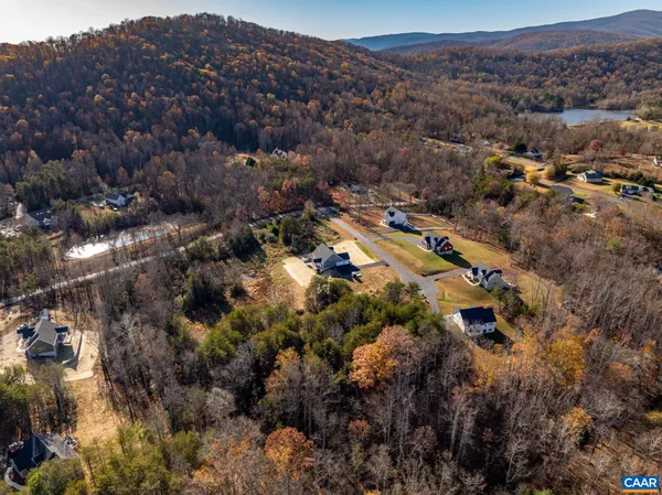 an aerial view of house with mountain view