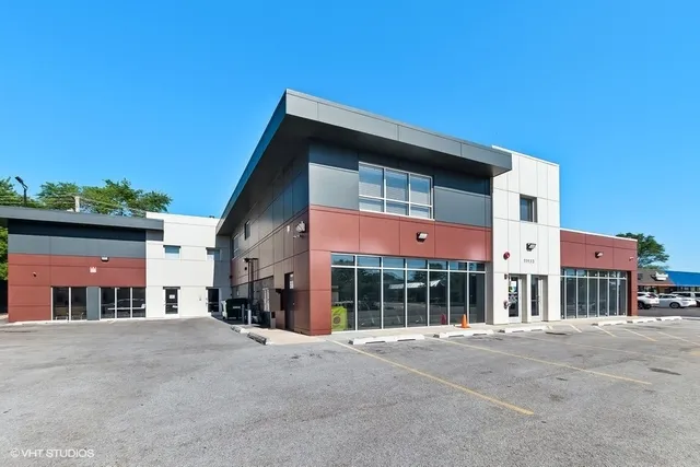 a front view of a building with a road