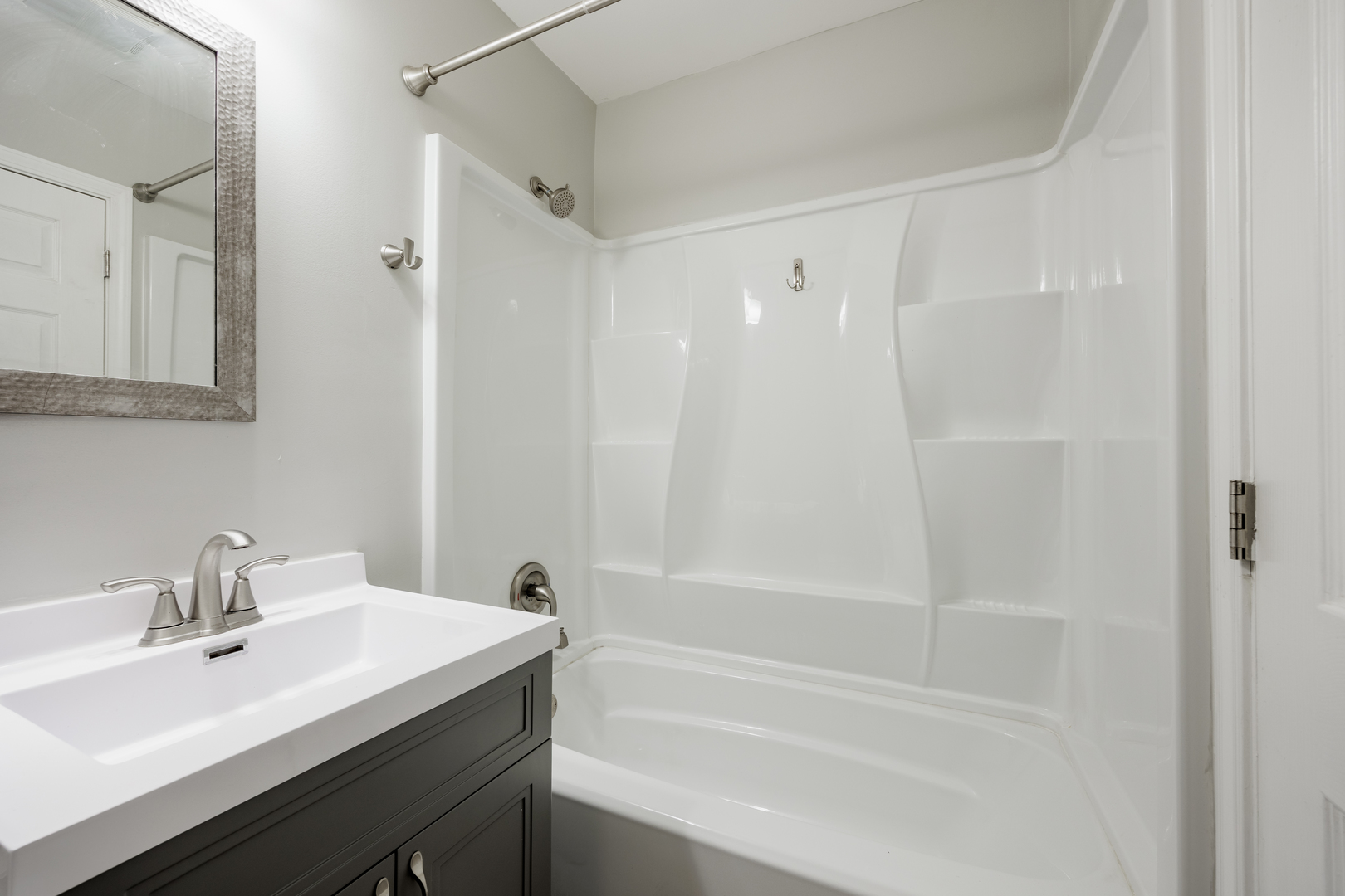 11933 South Pulaski Road, Unit 3 Alsip, IL 60803 - Photo 6 of 9 a bathroom with a bathtub shower sink and a sink