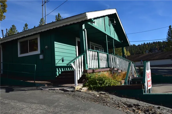 a view of a house with a street