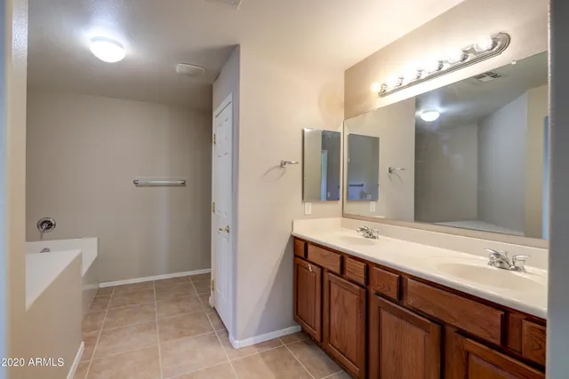 a bathroom with a tub and sink