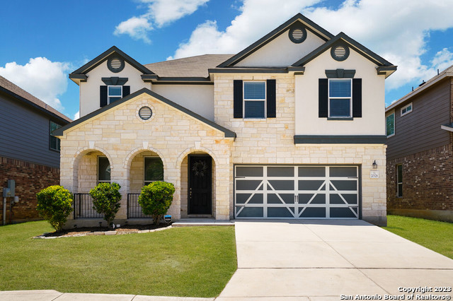 20326 Roche Oak San Antonio, TX 78259 - Photo 1 of 1 a front view of a house with a yard and potted plants