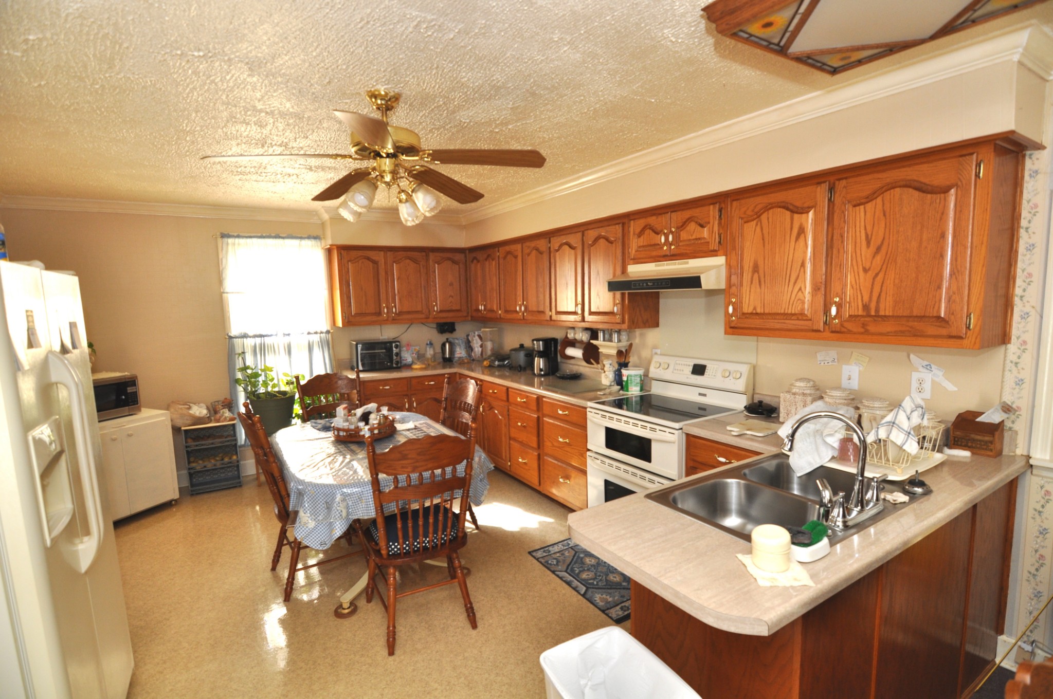 238 Putman Well Road Rockvale, TN 37153 - Photo 4 of 42 a kitchen with a sink cabinets a counter top space and appliances
