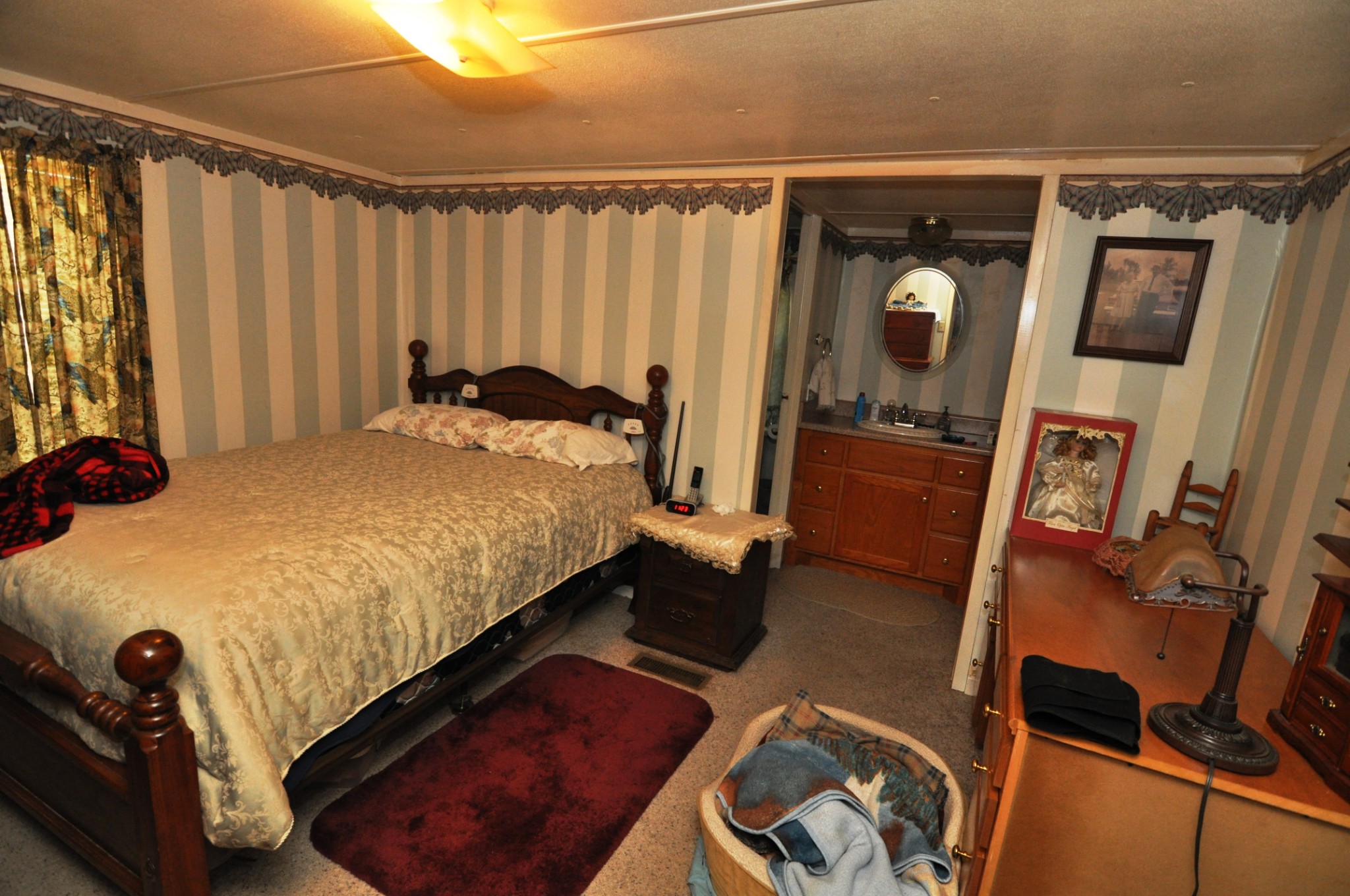 238 Putman Well Road Rockvale, TN 37153 - Photo 8 of 42 a bed sitting in a room next to a window