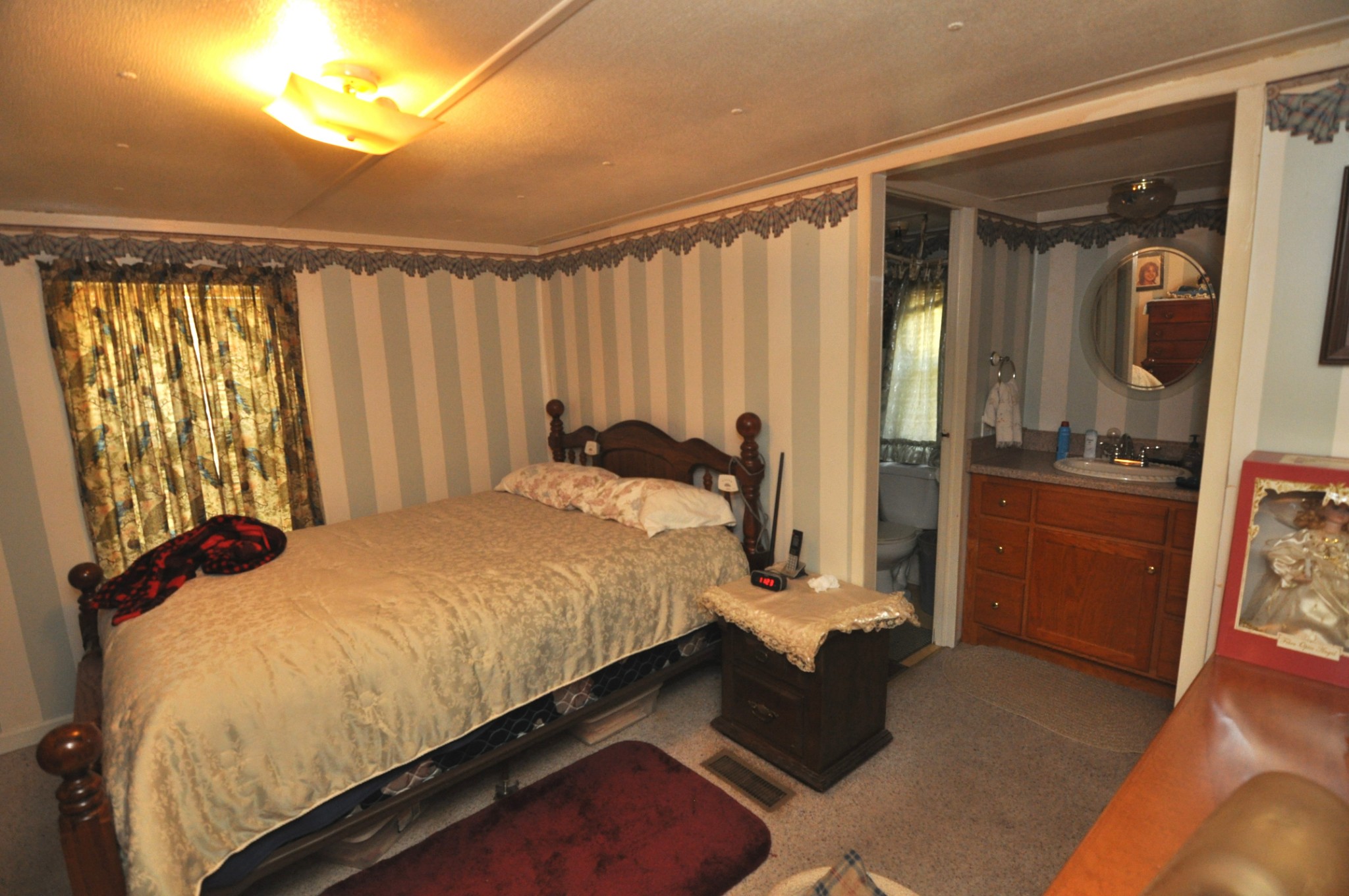 238 Putman Well Road Rockvale, TN 37153 - Photo 9 of 42 a bed sitting in a room next to a window