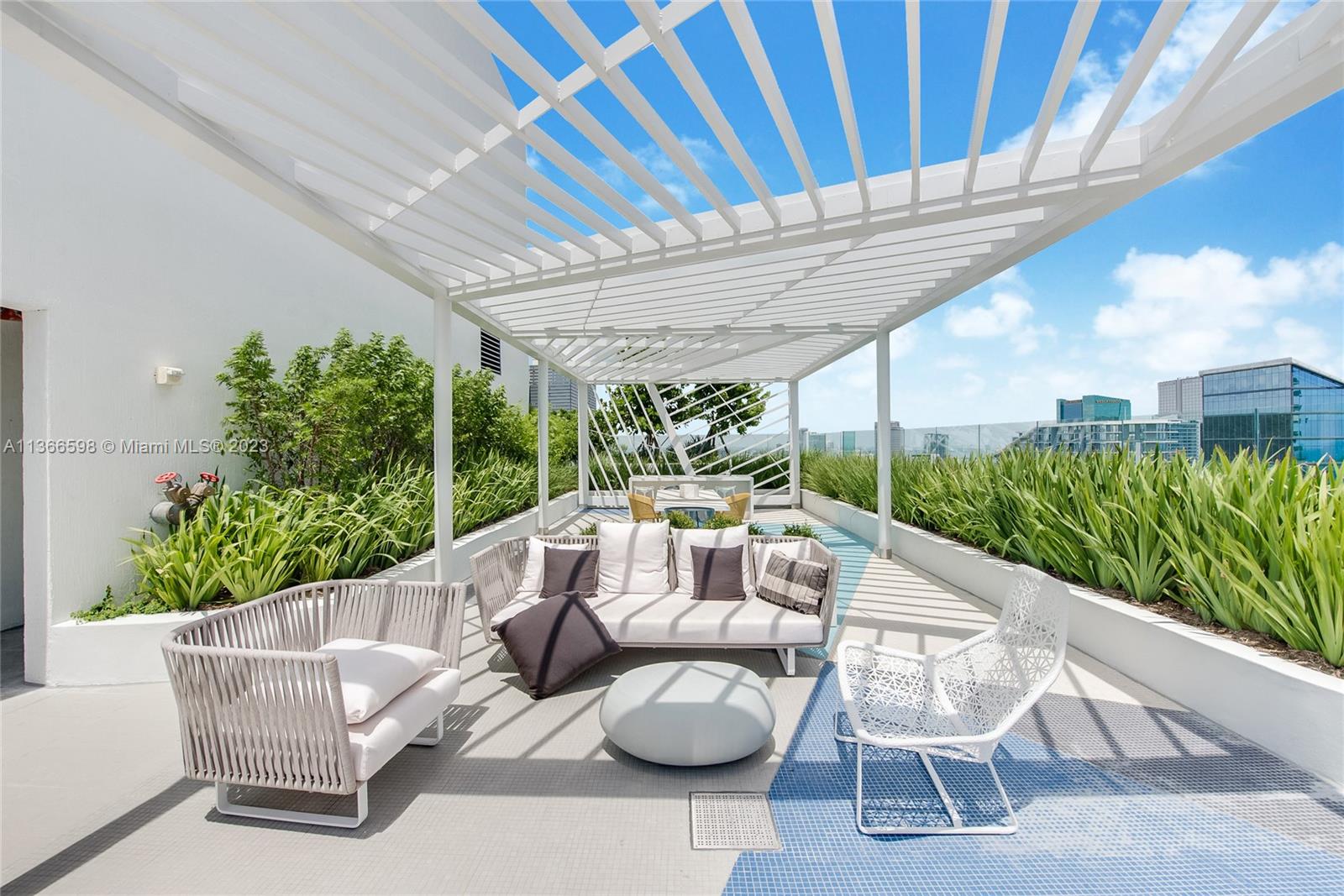 55 Southwest 9th Street, Unit 3607 Miami, FL 33130 - Photo 12 of 22 a view of a patio with couches chairs and a potted plant