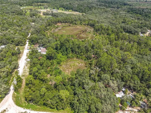 a view of a yard with an outdoor space