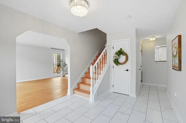 wooden floor with windows and entryway