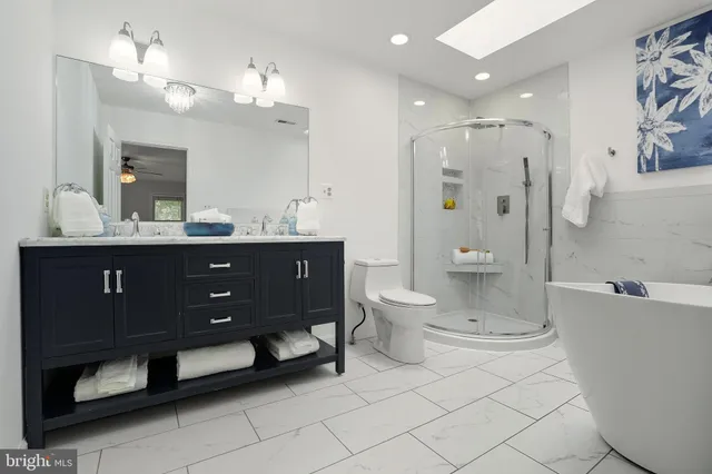 a bathroom with a toilet and a bathtub