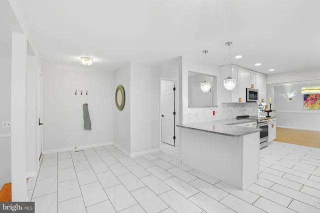 a large kitchen with a lot of counter space and a sink