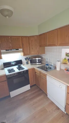 a kitchen with a stove and a sink