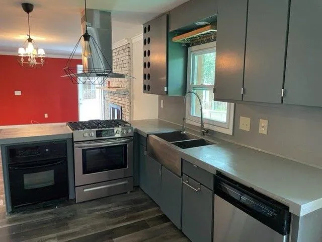 a kitchen with a stove and a microwave