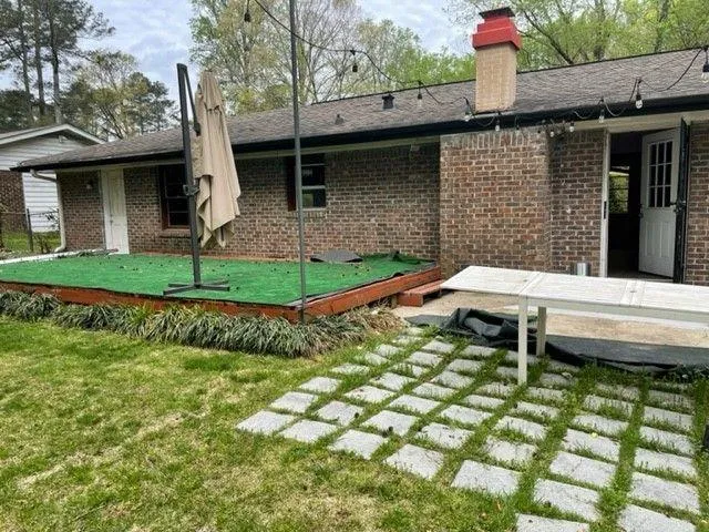 a small garden covered with tall trees