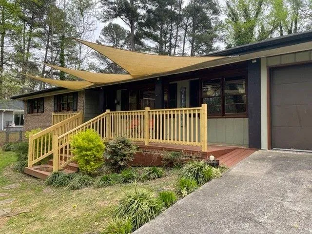 a front view of a house with garden