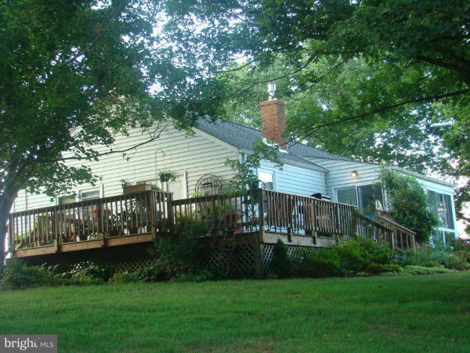 16145 Sheads Mountain Road Rixeyville, VA 22737 - Photo 1 of 20 a front view of a house with garden