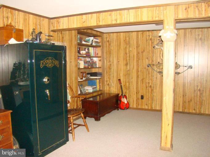 16145 Sheads Mountain Road Rixeyville, VA 22737 - Photo 11 of 20 a view of a bedroom with wooden floor and windows