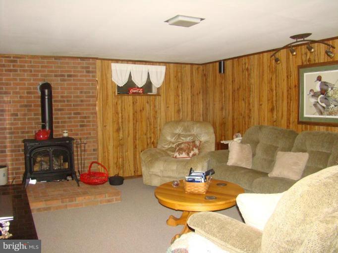 16145 Sheads Mountain Road Rixeyville, VA 22737 - Photo 13 of 20 a living room with furniture and a wooden floor