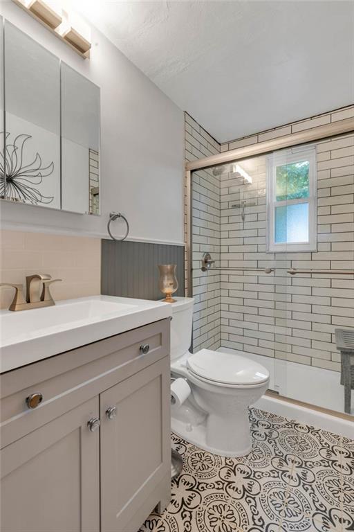 208 Gass Road Pittsburgh, PA 15229 - Photo 16 of 22 a bathroom with a granite countertop sink a toilet and a mirror