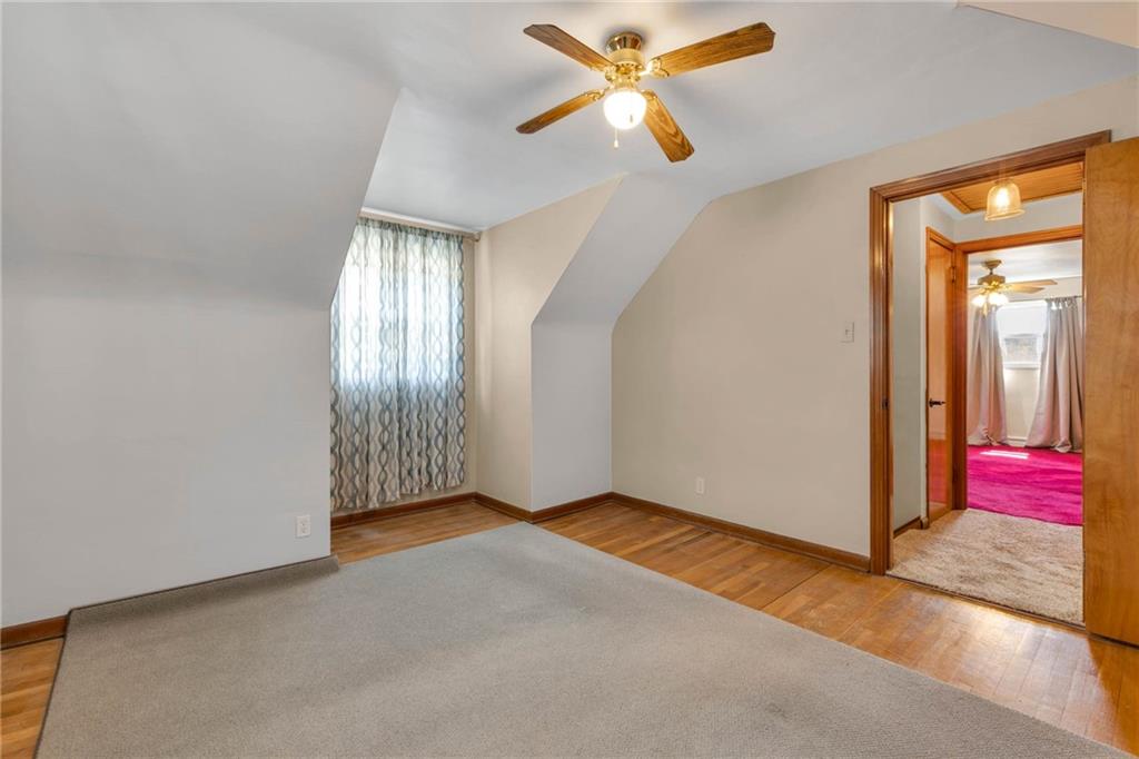 208 Gass Road Pittsburgh, PA 15229 - Photo 18 of 22 an empty room with windows and fan